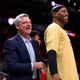 Atlanta Hawks owner Tony Ressler, left, speaks to forward Vince Carter before an NBA basketball game against the Indiana Pacers Wednesday, April 10, 2019, in Atlanta.